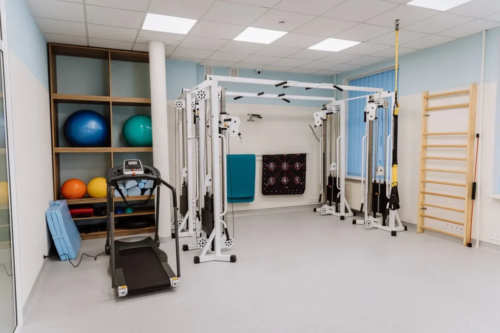 A fitness gym filled with professional equipment for effective workouts and physical therapy.