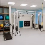 A fitness gym filled with professional equipment for effective workouts and physical therapy.